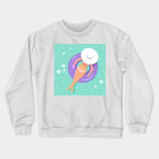 Woman floating on rubber ring with cocktail in her hand Crewneck Sweatshirt